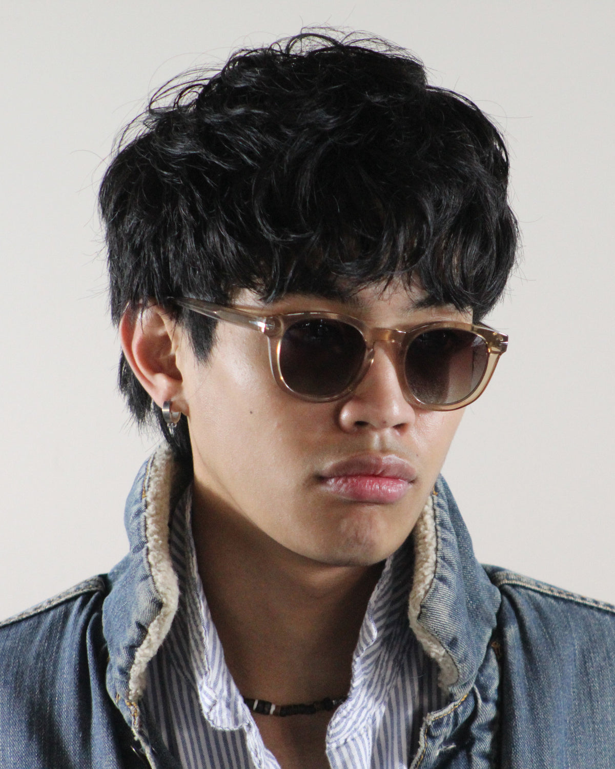 The Riviera Beige sunglasses worn on model