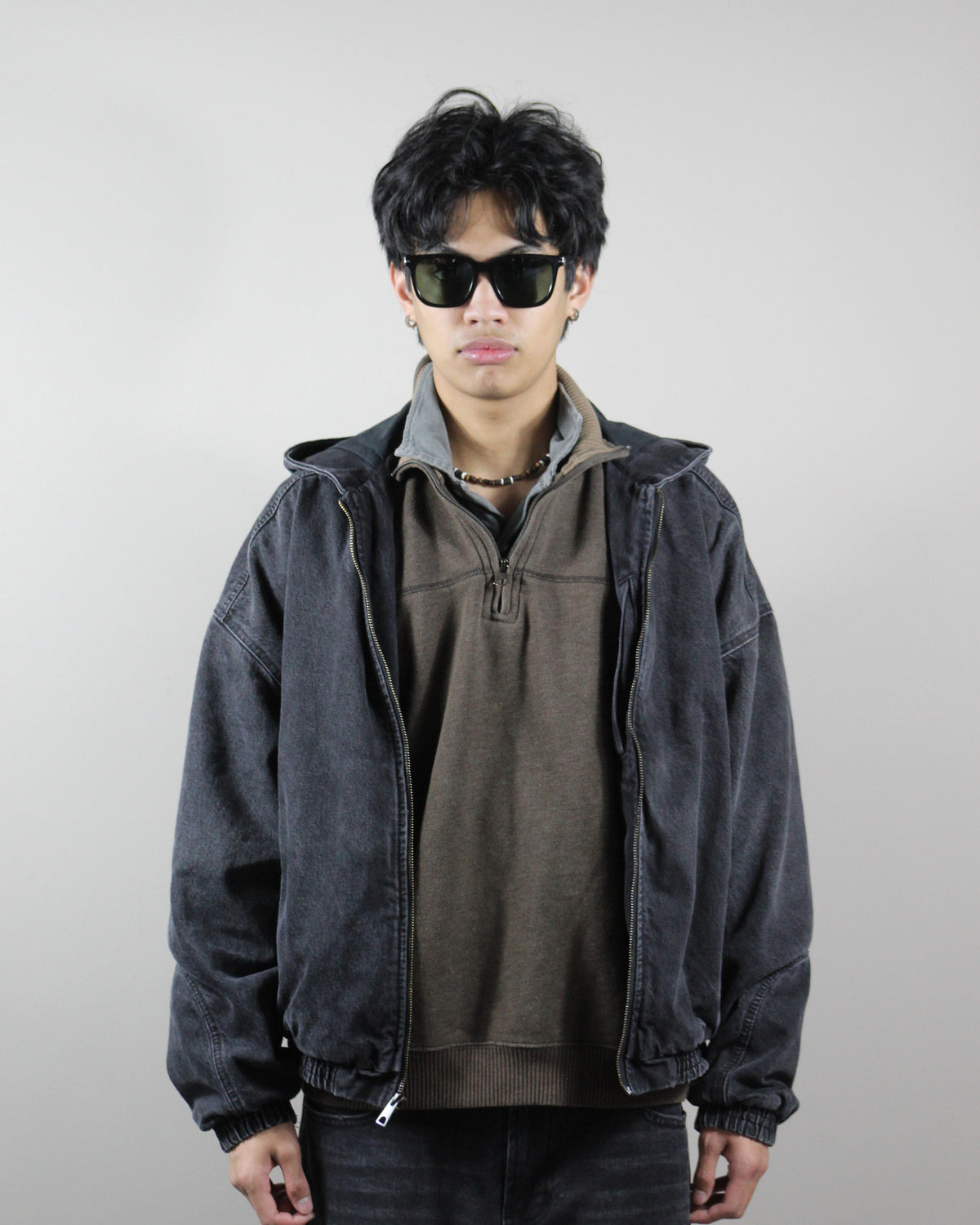 The Corsair Black/Green sunglasses worn on model, full look