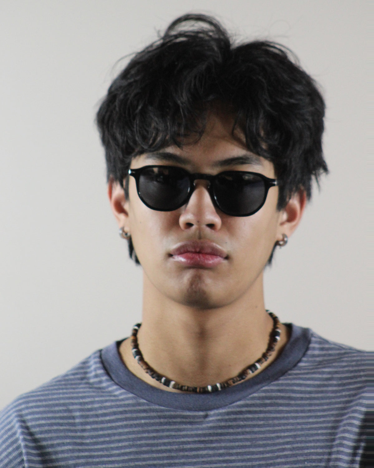 The Offshore Black sunglasses worn on model