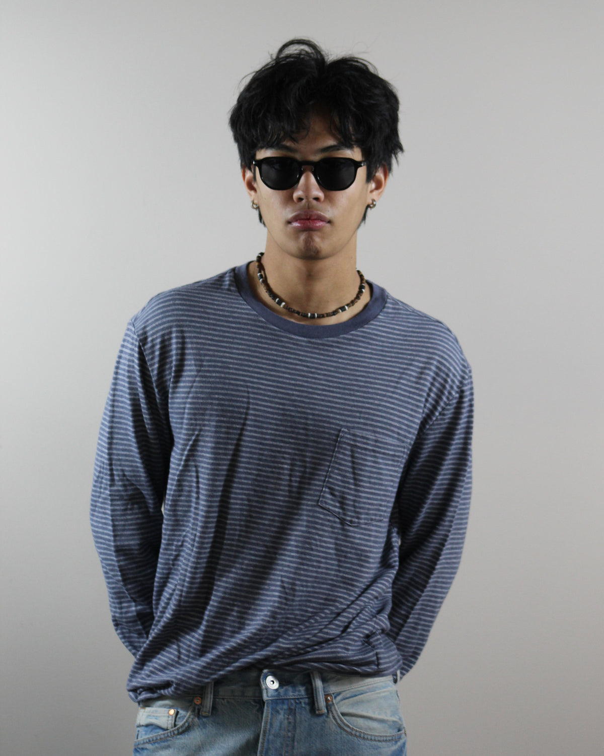 The Offshore Black sunglasses worn on model, full look