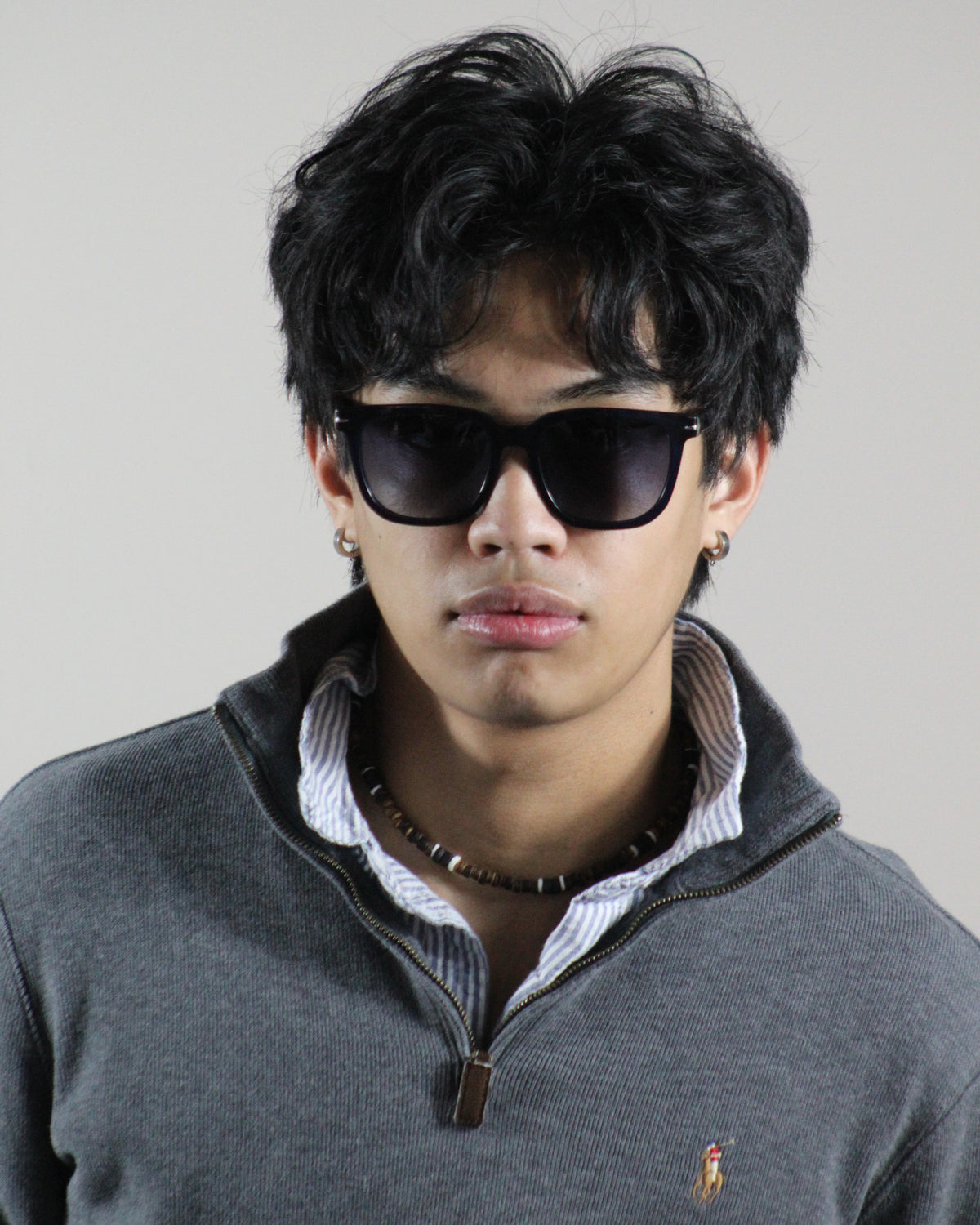 The Riviera Black sunglasses worn on model